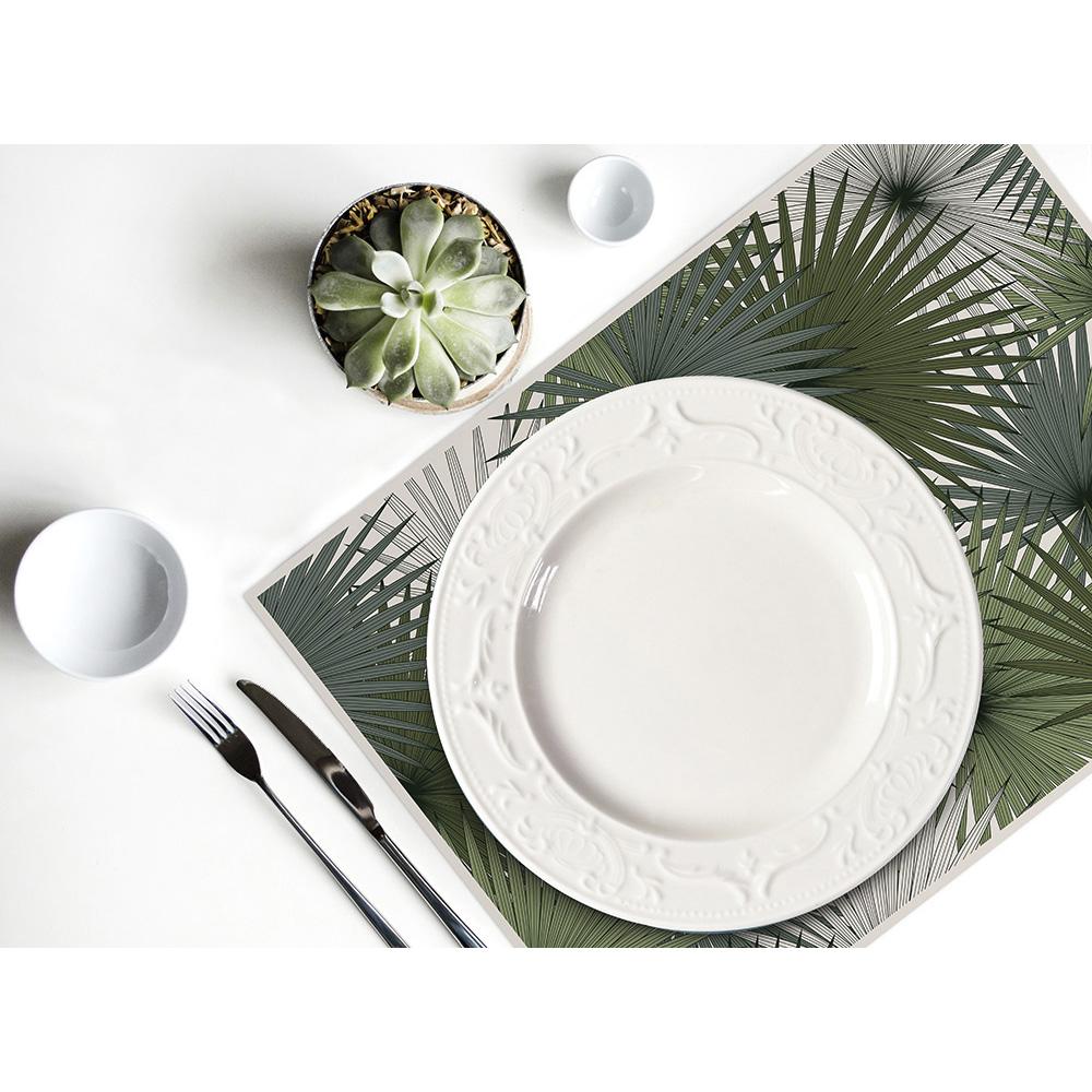Laissez-vous séduire par ce set de table rectangle en vinyle imprimé ! Ces feuilles de yucca donneront une ambiance de jardin botanique à votre extérieur ! On adore !